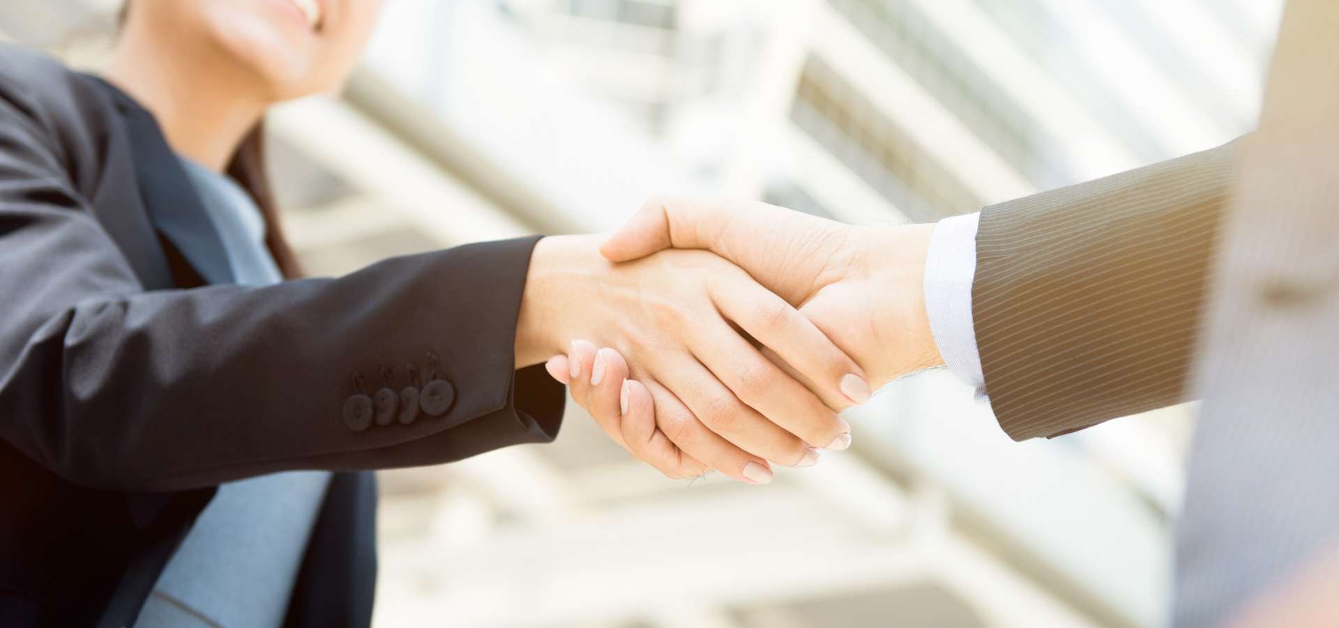 businesswoman making handshake with a businessman female leader concept