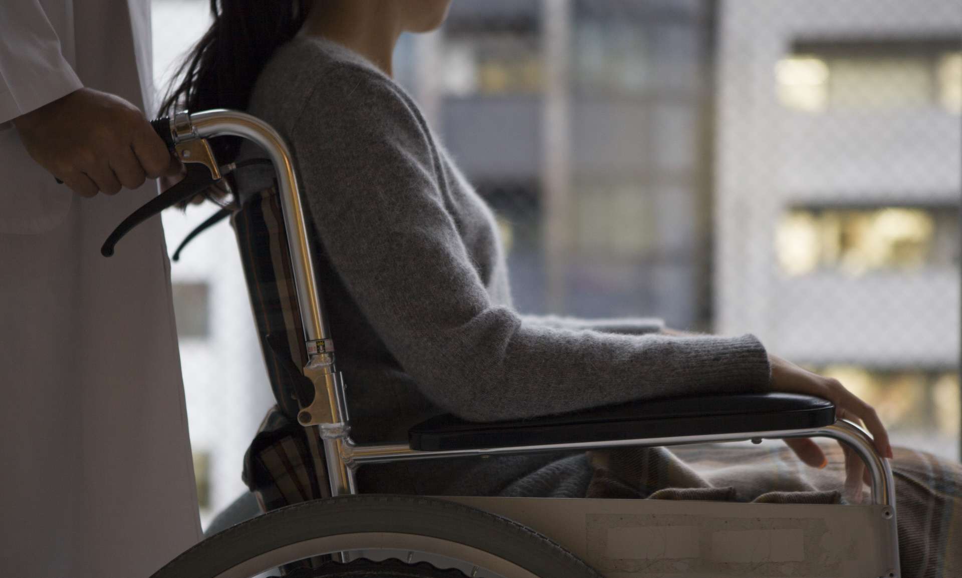 Doctor pushing wheelchair